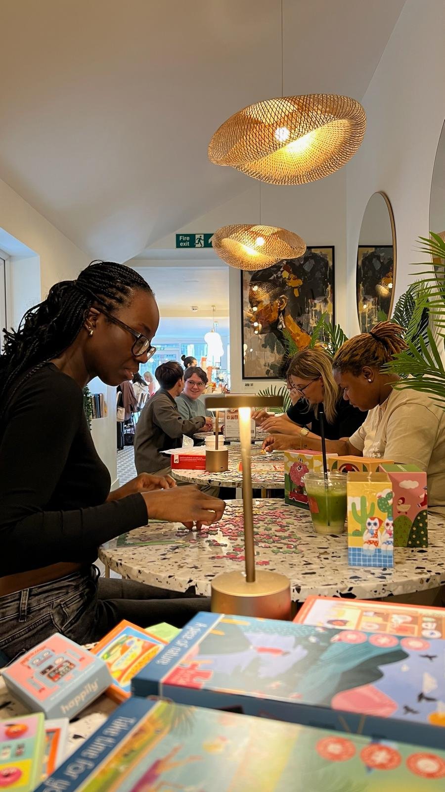 A group of women gathered round a table working on a puzzle