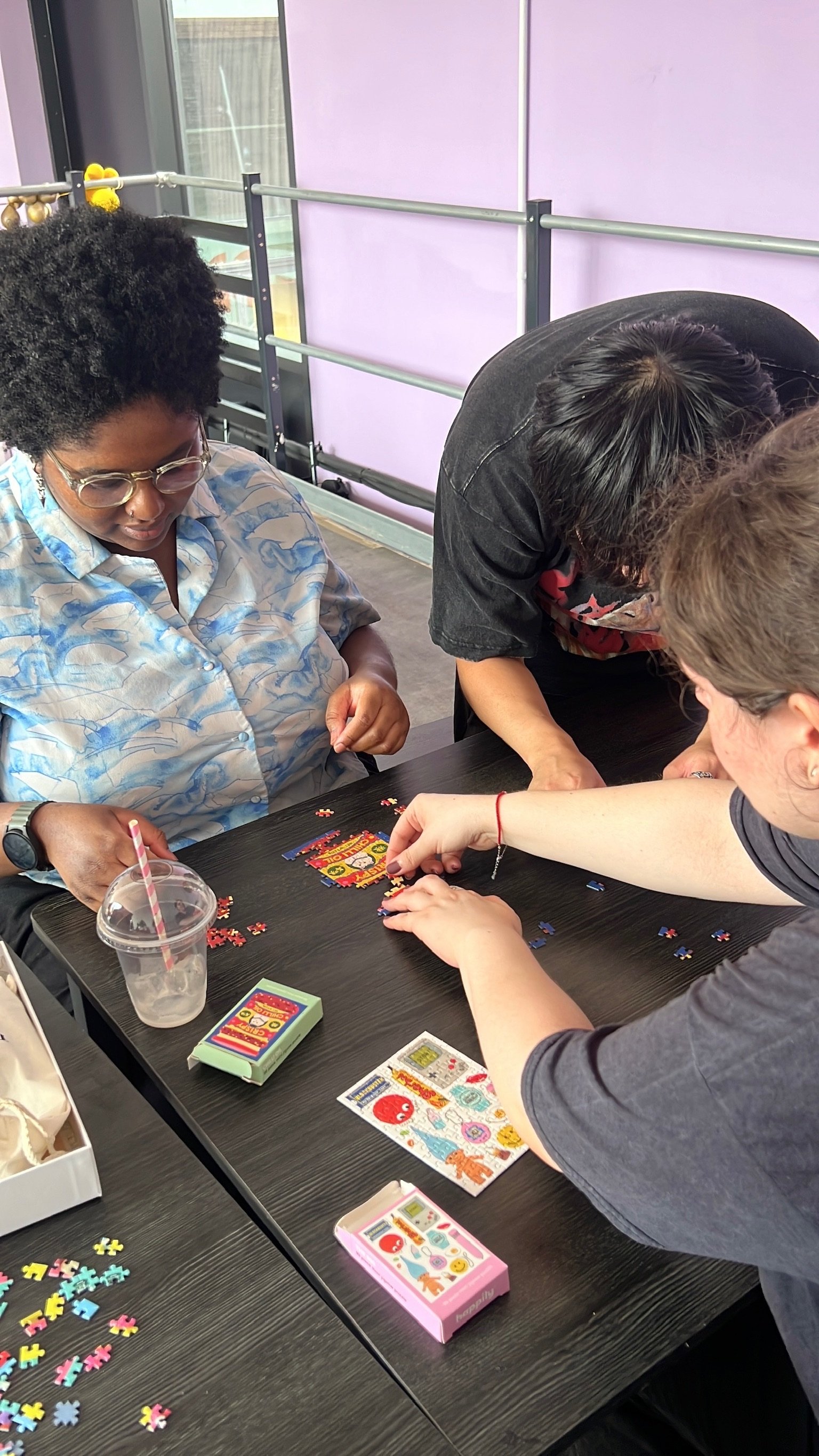 Hands sorting puzzle pieces on the table